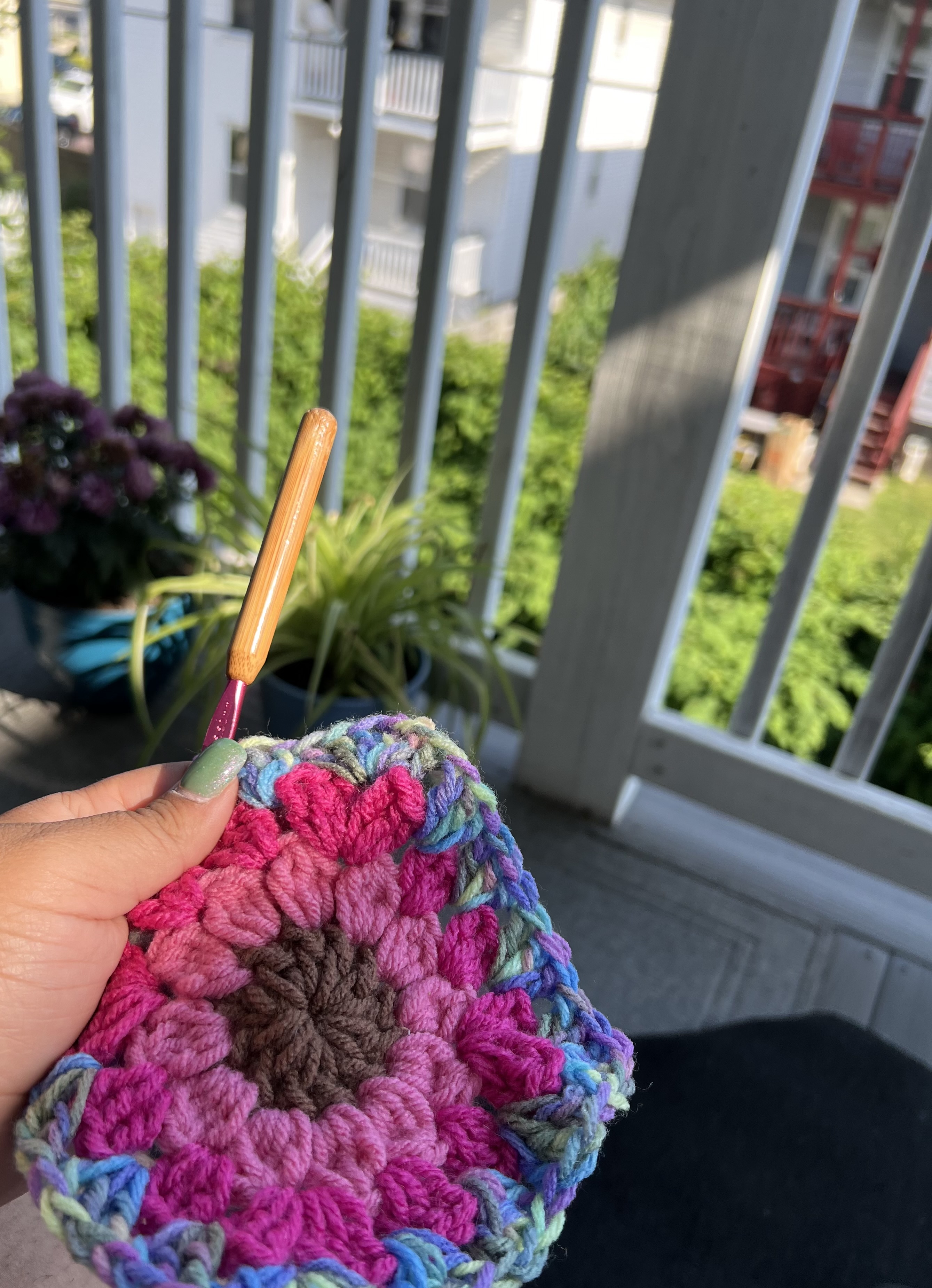 A handmade red crochet heart motif